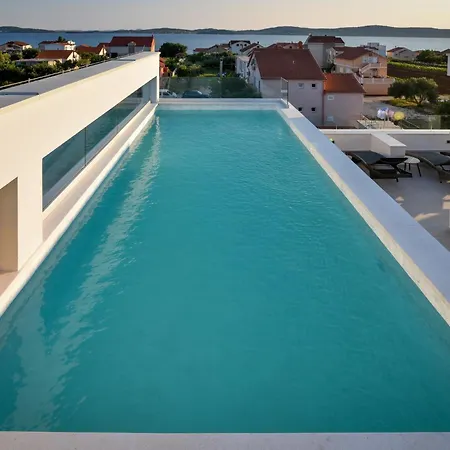 With Heated Rooftop Pool,