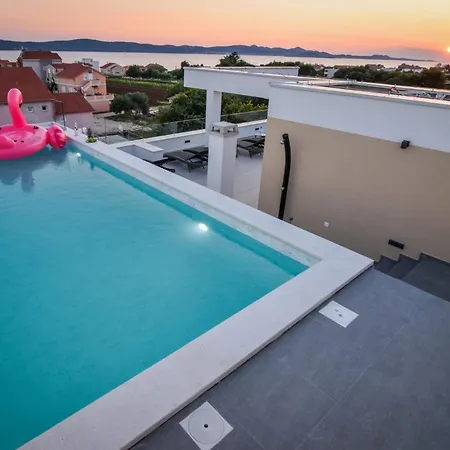 With Heated Rooftop Pool,
